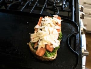 Kale Pesto grilled cheese sandwich cooking on stove