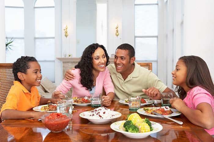 Family eating at table together