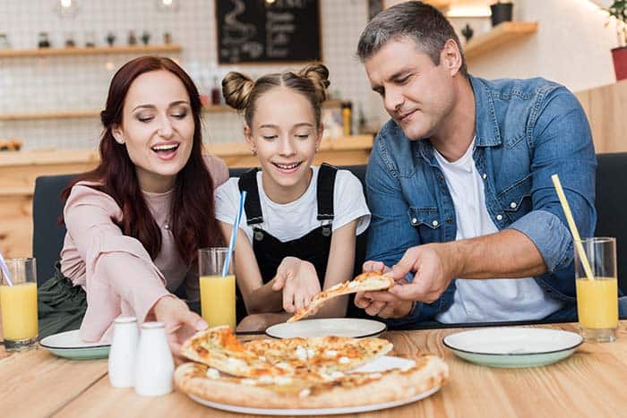 Family eat pizza for family meal