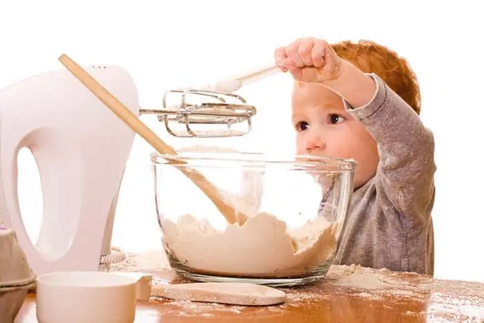 Kid with mixer and mixing bowl