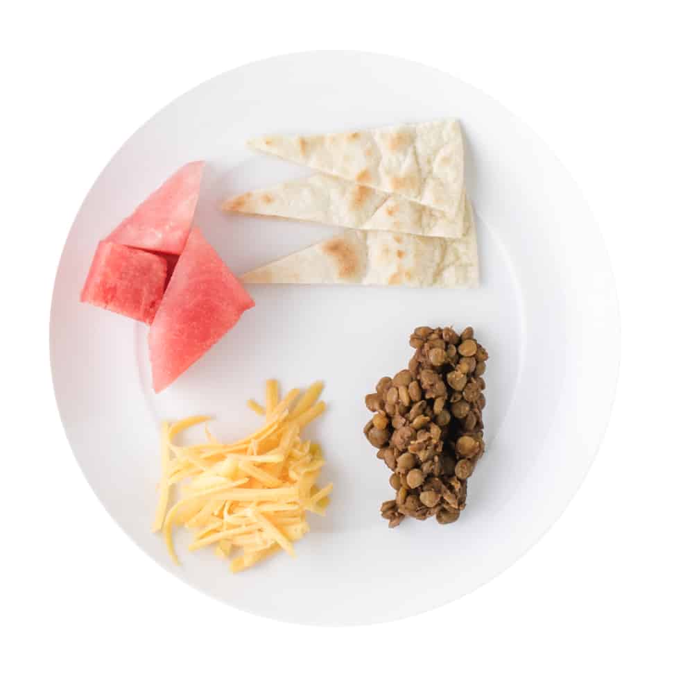 Lentil tacos with cheese, tortillas, and watermelon