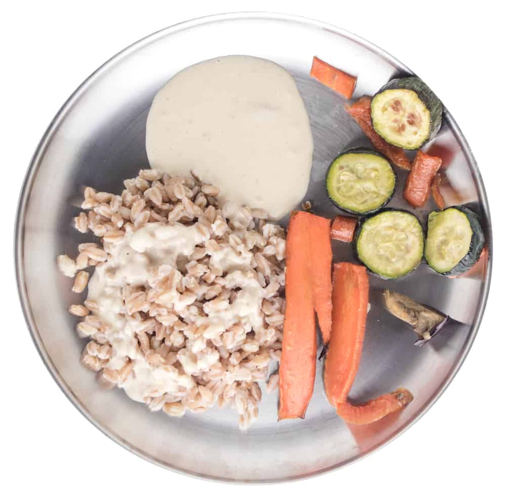 Toddler Lunches | New Ways Nutrition Grain bowl with barley, chickpeas, roasted veggies and tahini sauce