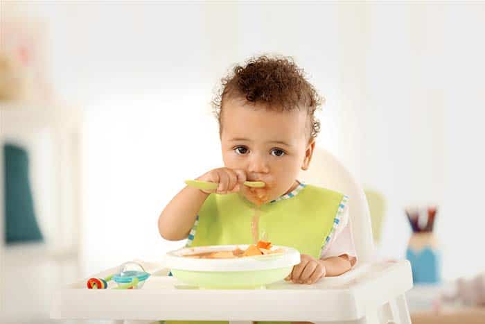 baby eating with spoon