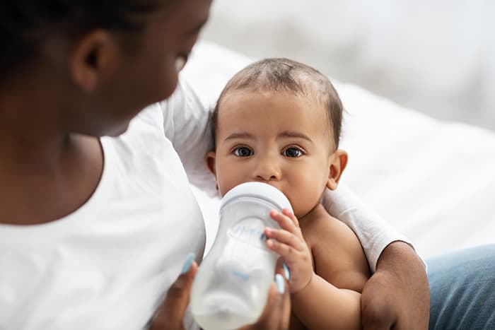 baby drinking from bottle