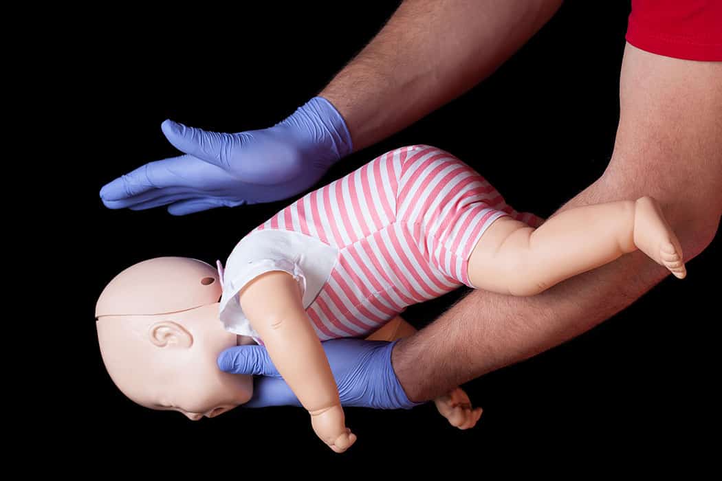 Infant CPR example on doll